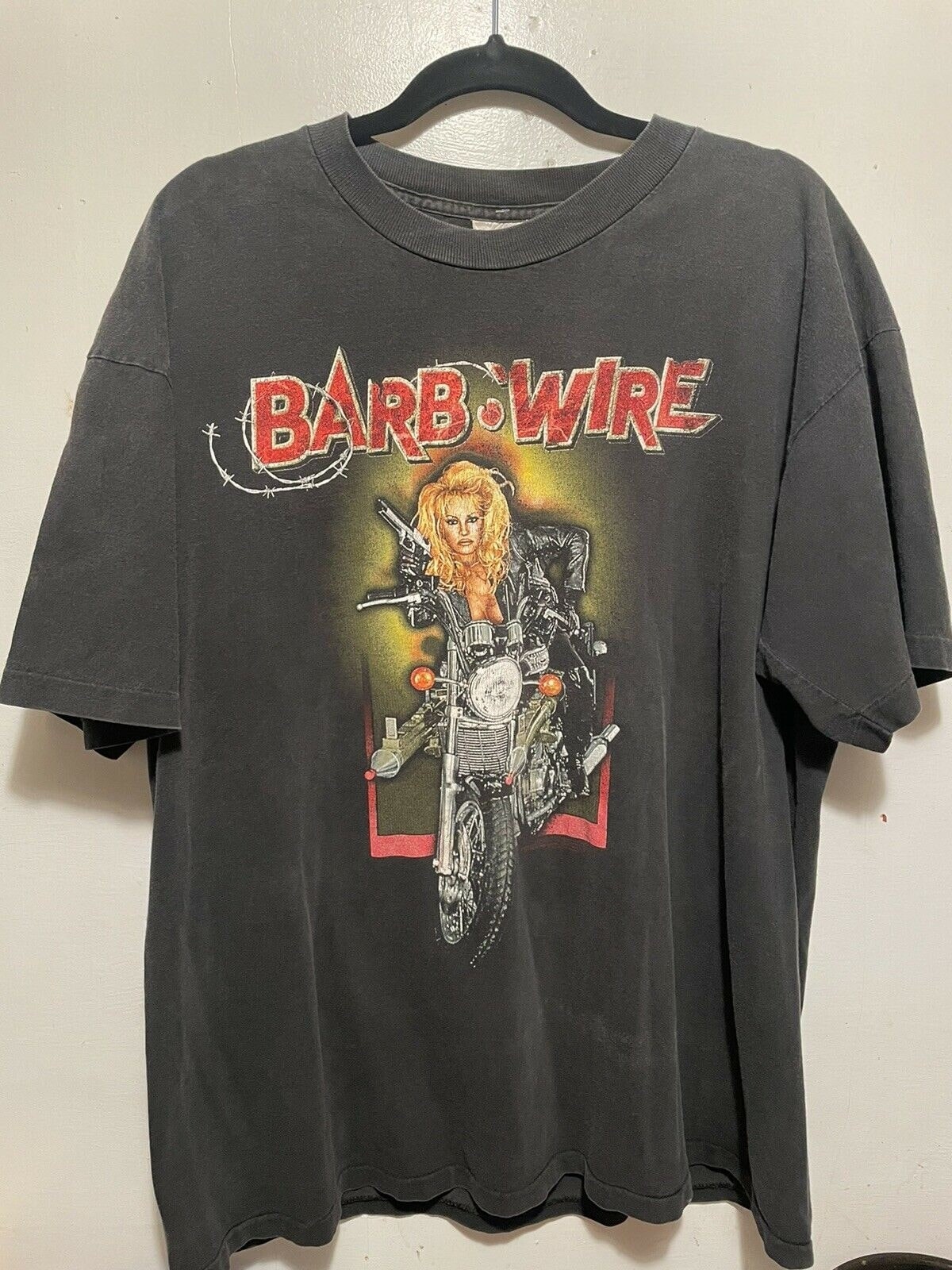 Pamela Barb Wire Movie Promo Vintage Art Unisex T-Shirt Pamela Barb Wire Movie Promo Vintage Art Unisex T-Shirt