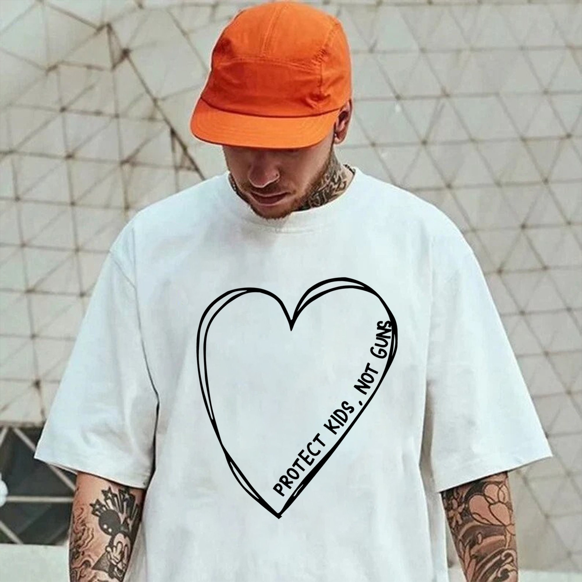 Protect Kids Not Guns Big Heart Unisex T-Shirt Protect Kids Not Guns Big Heart Unisex T-Shirt