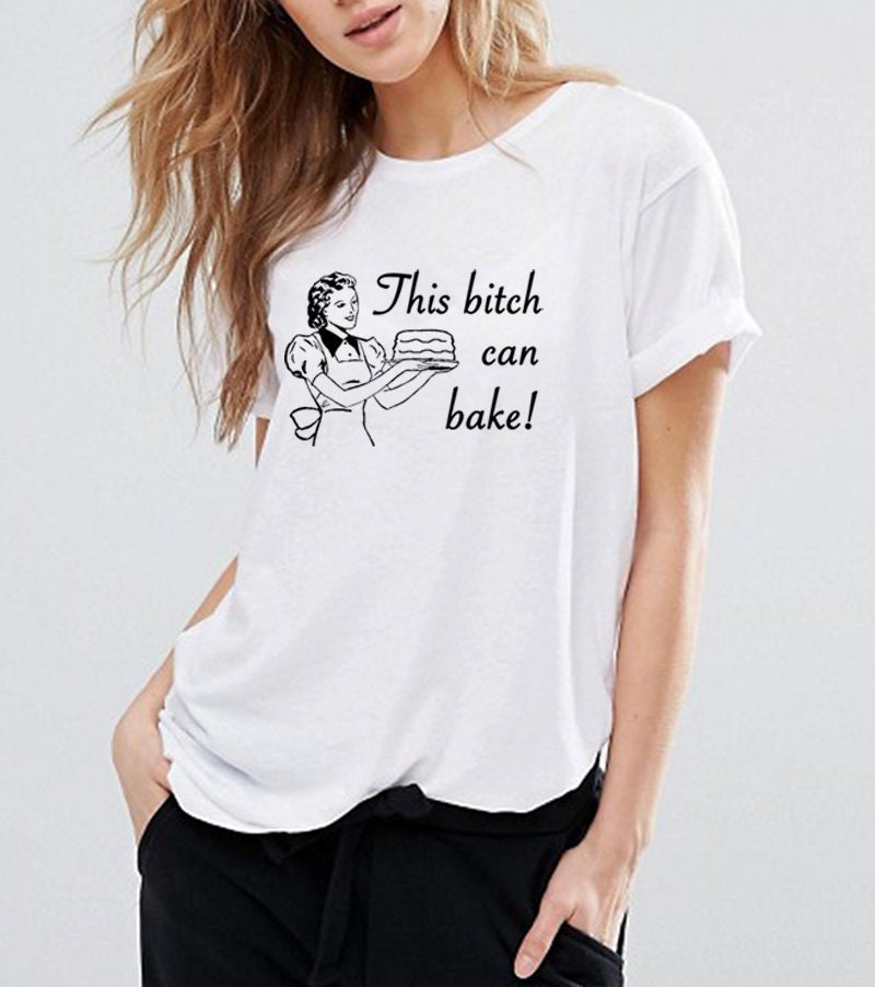 This Bitch Can Bake Baking Cupcakes Retro Housewife Unisex T-Shirt This Bitch Can Bake Baking Cupcakes Retro Housewife Unisex T-Shirt