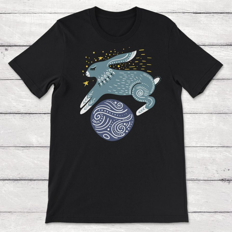 Whimsical Rabbit Jumping Over a Planet Unisex T-Shirt Whimsical Rabbit Jumping Over a Planet Unisex T-Shirt
